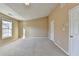 Bright bedroom with carpeting and a large window allowing for abundant natural light at 1749 Coleville Oak Ln, Lawrenceville, GA 30046