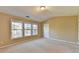 Bright bedroom featuring three windows offering lots of natural light at 1749 Coleville Oak Ln, Lawrenceville, GA 30046