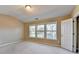 Bright bedroom featuring three windows offering lots of natural light at 1749 Coleville Oak Ln, Lawrenceville, GA 30046