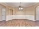 Inviting dining room with hardwood floors, decorative molding, and stylish chandelier at 1749 Coleville Oak Ln, Lawrenceville, GA 30046