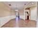 Inviting dining room with hardwood floors, decorative molding, and view to kitchen at 1749 Coleville Oak Ln, Lawrenceville, GA 30046