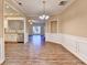 Inviting dining room with hardwood floors, decorative molding, and view to kitchen at 1749 Coleville Oak Ln, Lawrenceville, GA 30046