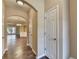 Hallway with hardwood floors offering views of the dining and living room at 1749 Coleville Oak Ln, Lawrenceville, GA 30046