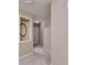 Neutral hallway featuring tan walls, carpet, and access to other rooms at 1749 Coleville Oak Ln, Lawrenceville, GA 30046