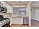 Charming kitchen with stainless steel appliances, granite countertops, and open access to living spaces at 1749 Coleville Oak Ln, Lawrenceville, GA 30046