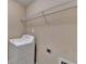 Functional laundry room with washer and convenient shelving at 1749 Coleville Oak Ln, Lawrenceville, GA 30046