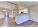 Open-concept view into the kitchen featuring white cabinets and granite countertops at 1749 Coleville Oak Ln, Lawrenceville, GA 30046