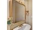 Classic powder room with a pedestal sink, decorative mirror and lovely finishes at 1749 Coleville Oak Ln, Lawrenceville, GA 30046