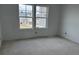 A spacious bedroom with two bright windows and potential for customization at 2096 Boxwood Cir, Conyers, GA 30094