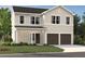 Charming two-story home with a covered entryway, two-car garage, and manicured front lawn at 2096 Boxwood Cir, Conyers, GA 30094