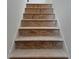 Unfinished wood stairs awaiting the personal touch of a new homeowner at 2096 Boxwood Cir, Conyers, GA 30094