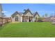 Spacious backyard with a well-maintained lawn and covered patio at 2250 Snug Ne Hbr, Marietta, GA 30066