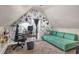 Cozy bedroom with a floral accent wall, desk area, and sofa at 2250 Snug Ne Hbr, Marietta, GA 30066