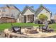 Backyard stone fire pit with seating, ideal for outdoor gatherings at 2250 Snug Ne Hbr, Marietta, GA 30066