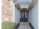 Elegant front door with decorative ironwork and stone accents at 2250 Snug Ne Hbr, Marietta, GA 30066