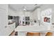 Bright kitchen with white cabinetry, breakfast bar, and stainless steel appliances at 2250 Snug Ne Hbr, Marietta, GA 30066