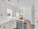 Bright kitchen with white cabinetry, stainless steel appliances, and ample counter space at 2250 Snug Ne Hbr, Marietta, GA 30066