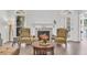 Cozy living room featuring a fireplace, two chairs, wood flooring, and a bright, airy atmosphere at 2250 Snug Ne Hbr, Marietta, GA 30066