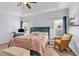 Inviting main bedroom features a large bed with plush bedding and a seating area at 2250 Snug Ne Hbr, Marietta, GA 30066