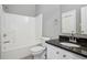 Bathroom features a combination tub/shower, large mirror, and a granite countertop at 2360 Johnson Rd, Atlanta, GA 30345