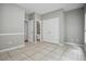 Spacious bedroom with tiled floors, double closets, and an en suite bathroom at 2360 Johnson Rd, Atlanta, GA 30345
