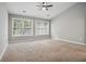 Bright primary bedroom with large windows and carpet flooring at 2360 Johnson Rd, Atlanta, GA 30345