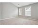Neutral bedroom featuring carpet and two windows that provide natural light at 2360 Johnson Rd, Atlanta, GA 30345