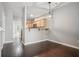 Dining area with dark wood floors, modern lighting, and open view of the kitchen at 2360 Johnson Rd, Atlanta, GA 30345