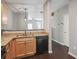 Kitchen with granite countertops, wood cabinets, and stainless steel dishwasher at 2360 Johnson Rd, Atlanta, GA 30345