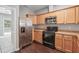 Kitchen featuring stainless steel appliances, wood cabinets, and granite countertops at 2360 Johnson Rd, Atlanta, GA 30345