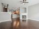 Living room with dark wood floors, fireplace, staircase, and view of the kitchen at 2360 Johnson Rd, Atlanta, GA 30345