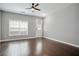 Bright living room with dark wood floors, neutral walls, and ceiling fan at 2360 Johnson Rd, Atlanta, GA 30345
