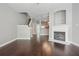 Living room with dark wood floors, fireplace, and staircase leading to upper level at 2360 Johnson Rd, Atlanta, GA 30345