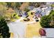 Aerial view of neighborhood homes with well-manicured lawns, mature trees and established landscaping at 207 Meadow Lake Dr, Carrollton, GA 30116
