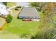 Aerial view of a home with a deck and patio on a well-maintained lawn at 207 Meadow Lake Dr, Carrollton, GA 30116