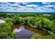 Overhead shot of the lake and surrounding trees at 207 Meadow Lake Dr, Carrollton, GA 30116