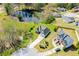 Aerial view of a home with lake access and well manicured lawn at 207 Meadow Lake Dr, Carrollton, GA 30116