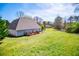 Large open backyard, lawn and landscaping with deck at 207 Meadow Lake Dr, Carrollton, GA 30116