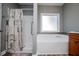Bathroom features a tub shower combination with a window at 207 Meadow Lake Dr, Carrollton, GA 30116