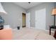 Bedroom has neutral carpet, paint, and two closets for ample storage and functionality at 207 Meadow Lake Dr, Carrollton, GA 30116