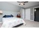 Sloped ceiling bedroom with neutral colors and carpet flooring at 207 Meadow Lake Dr, Carrollton, GA 30116