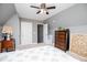 Upstairs bedroom showcasing a sloped ceiling, plush carpet, and ensuite bathroom at 207 Meadow Lake Dr, Carrollton, GA 30116