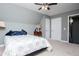 Cozy bedroom features carpet, overhead fan and neutral paint and is adjacent to a bathroom at 207 Meadow Lake Dr, Carrollton, GA 30116