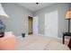 Well-lit bedroom with plush carpet, neutral paint colors, and ensuite access at 207 Meadow Lake Dr, Carrollton, GA 30116
