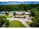 Aerial view of a community with a pool and tennis courts at 207 Meadow Lake Dr, Carrollton, GA 30116