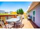 Outdoor wooden deck with green trees and backyard at 207 Meadow Lake Dr, Carrollton, GA 30116