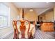 Bright dining area with vaulted ceiling, views to living area and access to the backyard at 207 Meadow Lake Dr, Carrollton, GA 30116