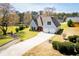Attractive home with a two-car garage, complemented by a neatly kept lawn and picturesque landscaping at 207 Meadow Lake Dr, Carrollton, GA 30116