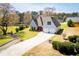 Inviting two-story home featuring an attached garage and beautifully landscaped grounds at 207 Meadow Lake Dr, Carrollton, GA 30116