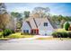 Attractive two-story home with a lush green lawn and a two-car garage at 207 Meadow Lake Dr, Carrollton, GA 30116